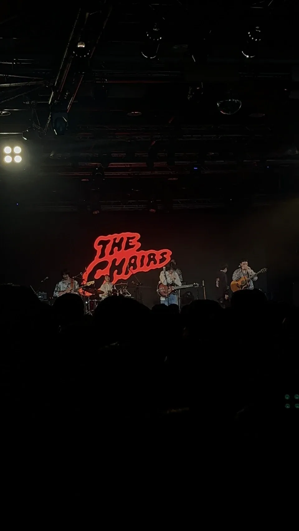 Live indie band The Chairs performing on stage