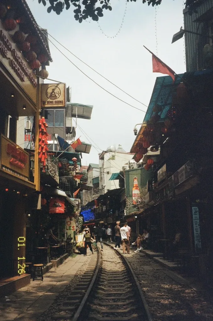 Hanoi Train Street with lanterns and flags