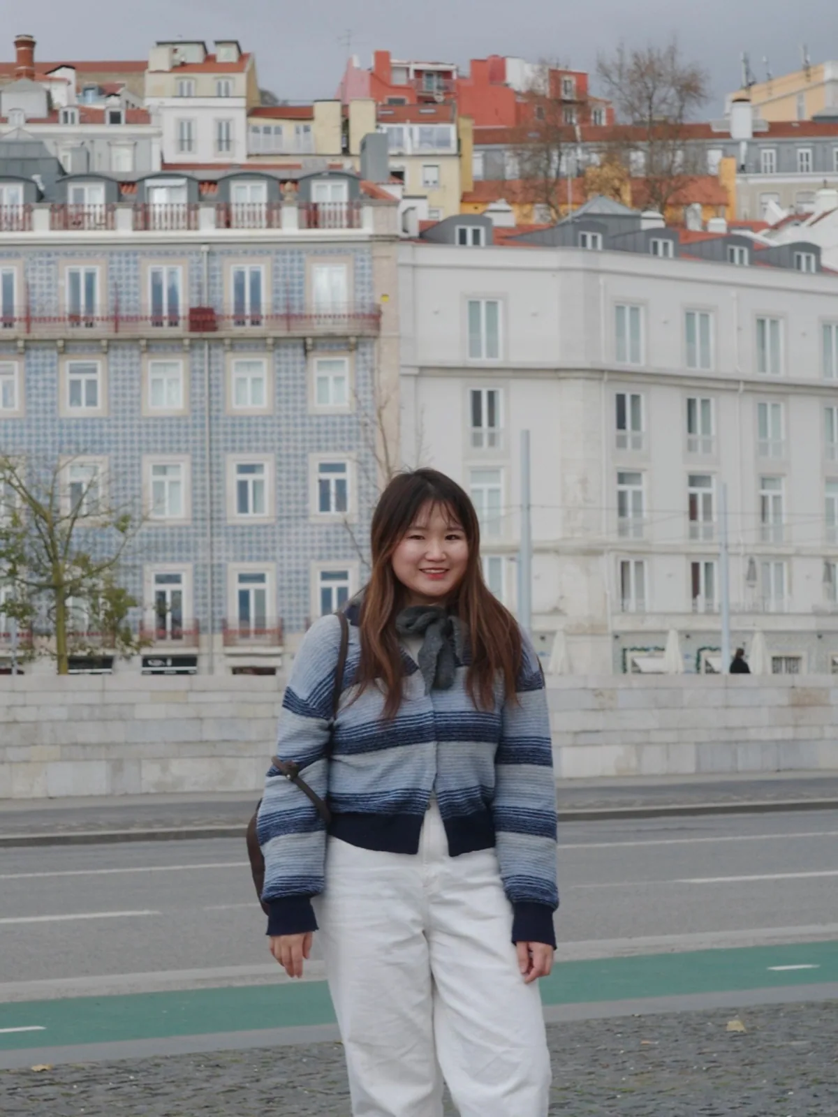 Alison in front of tiled Lisbon facades